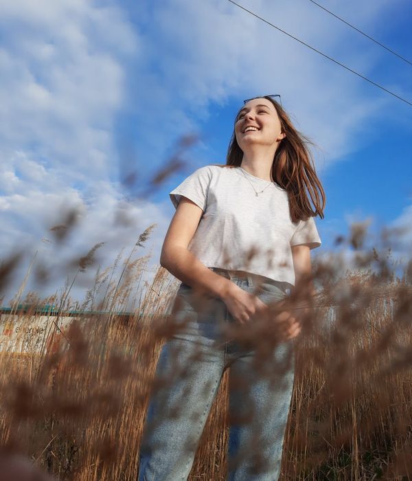A person looking energized and smiling after a gentle workout session.